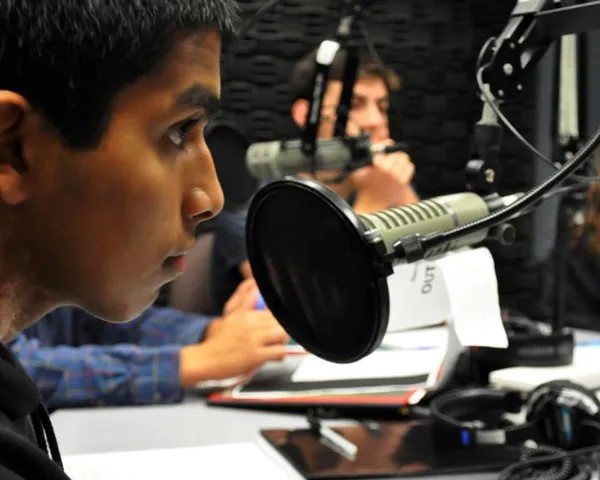 Student is in the radio room of the school