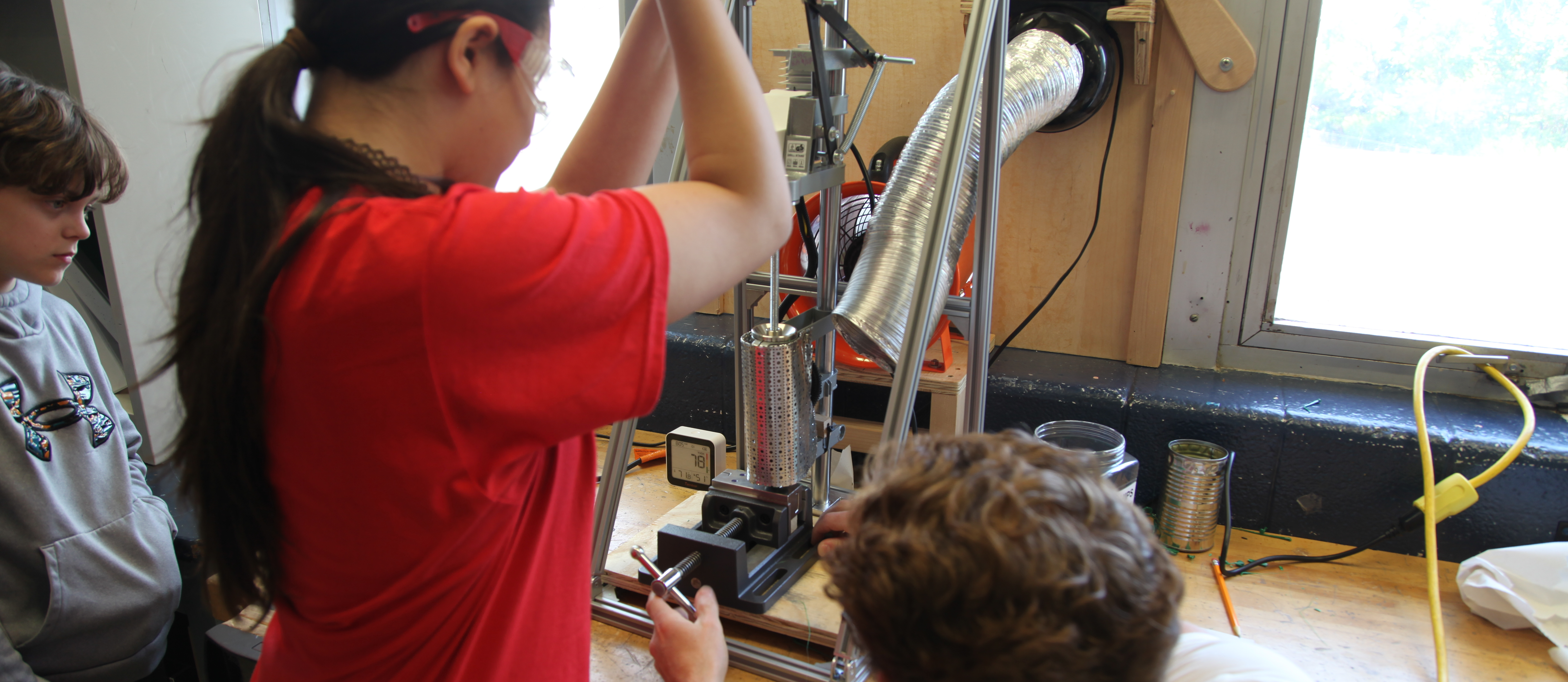 A Woodridge student works on injection molding in Industrial Arts class