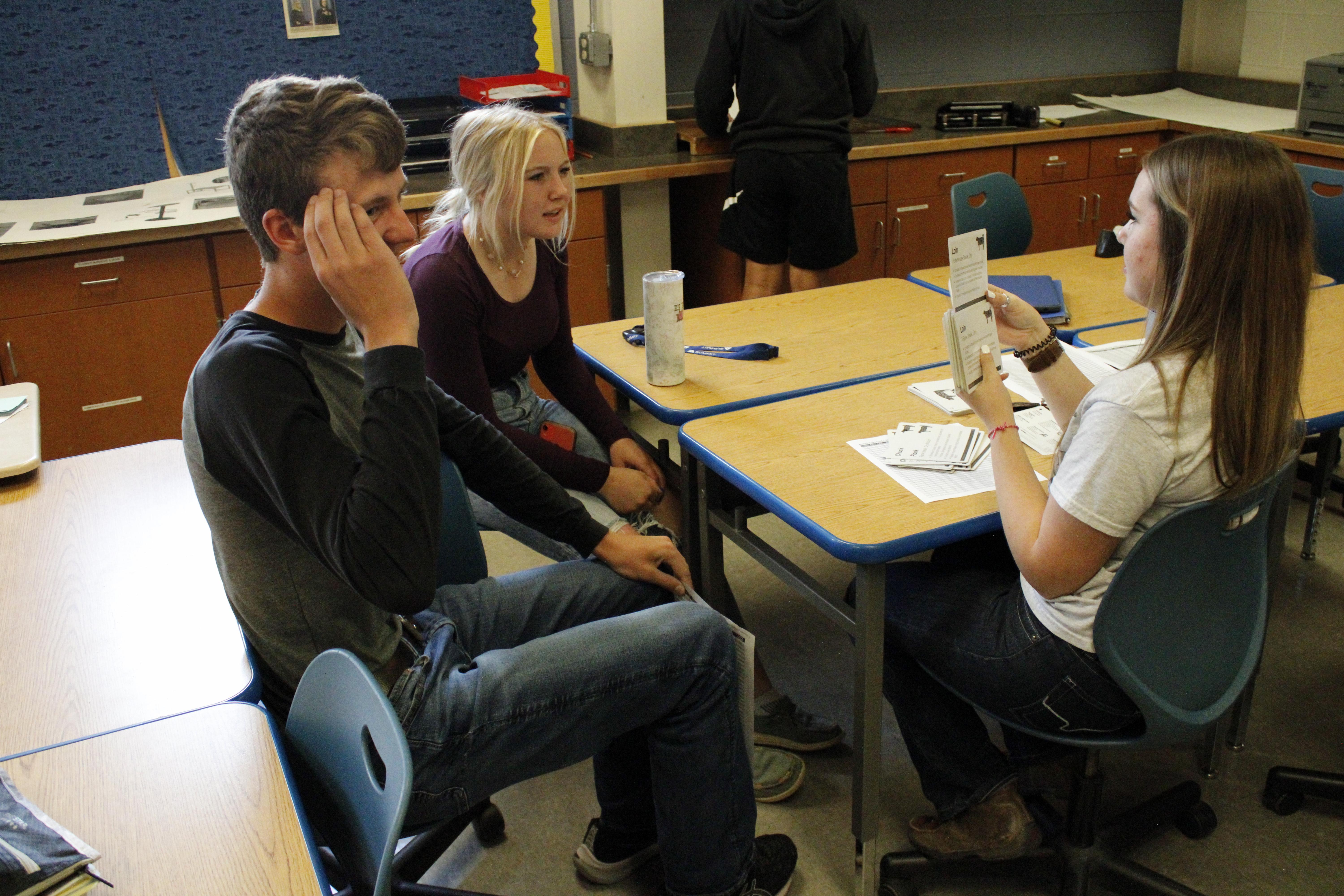students gathered around a table