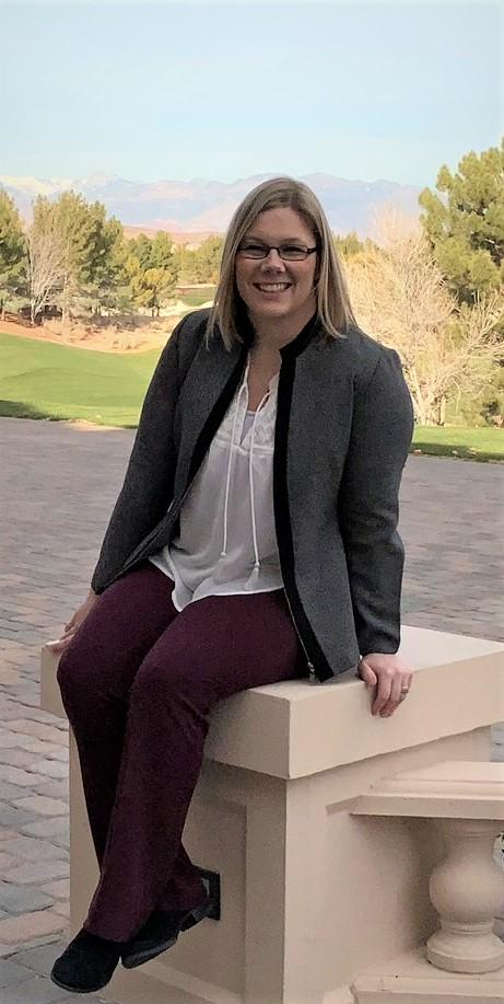 Mrs. Jewell sitting down