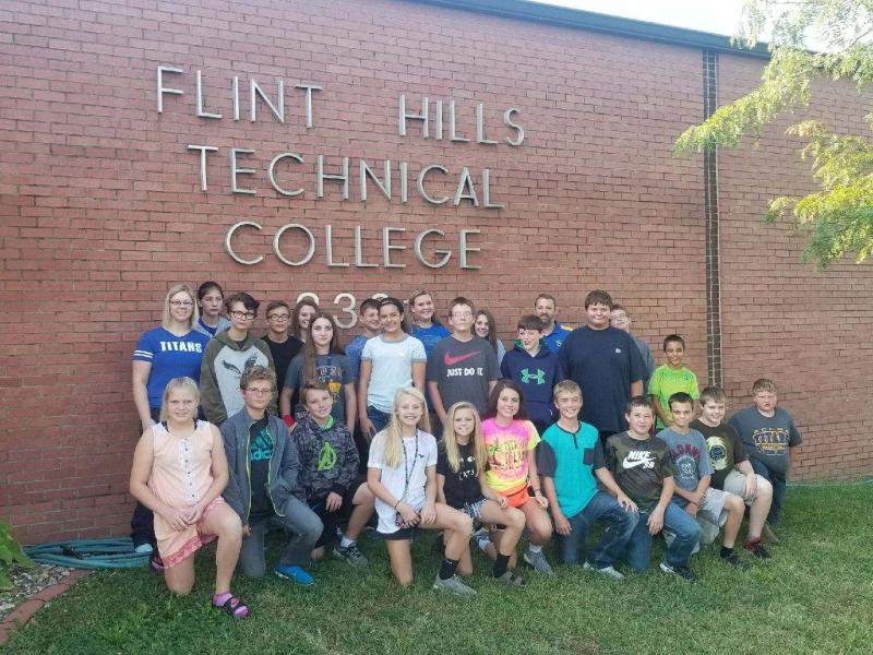 Kids posing in front of Flint Hills Technical College