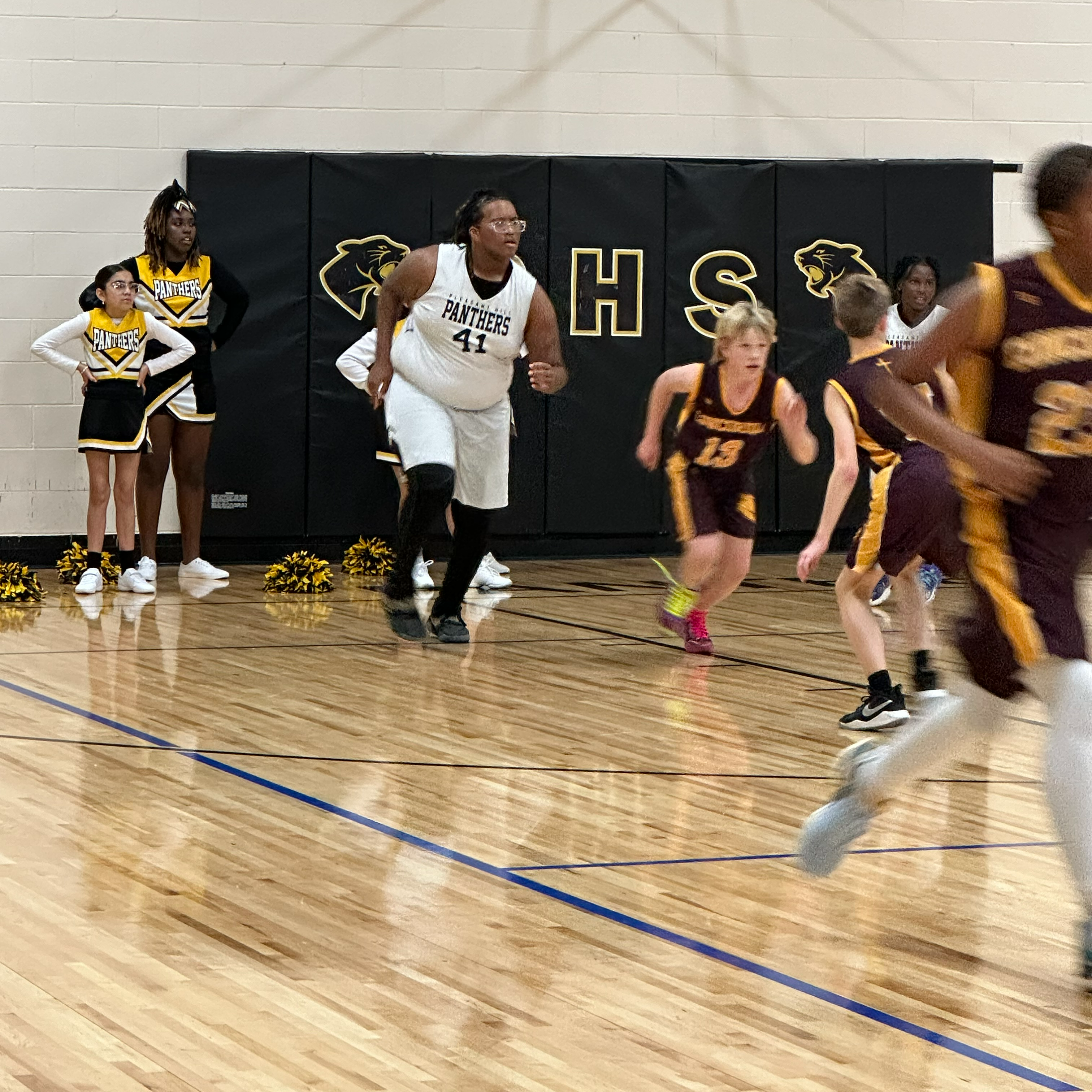 students playing basketball