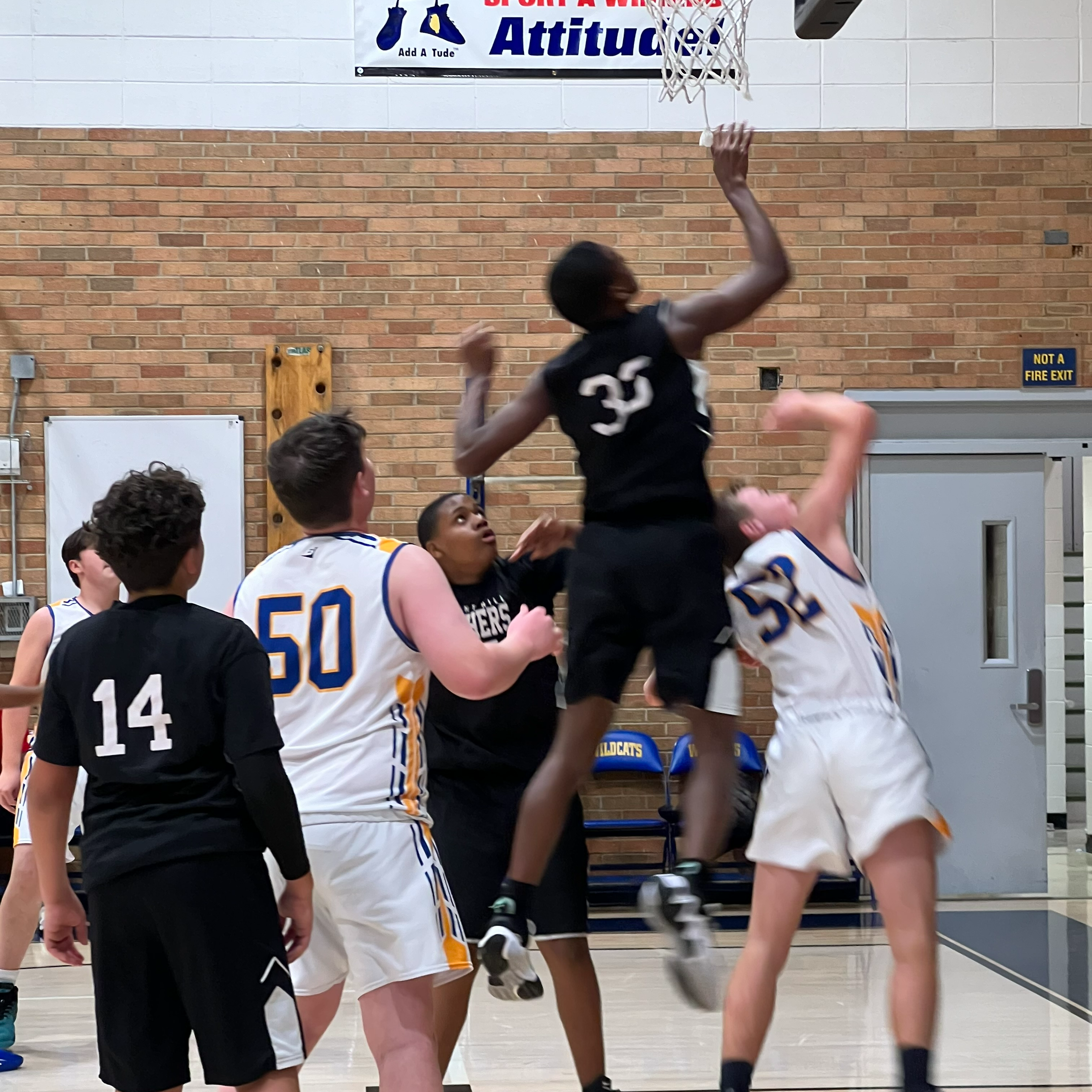 students playing basketball