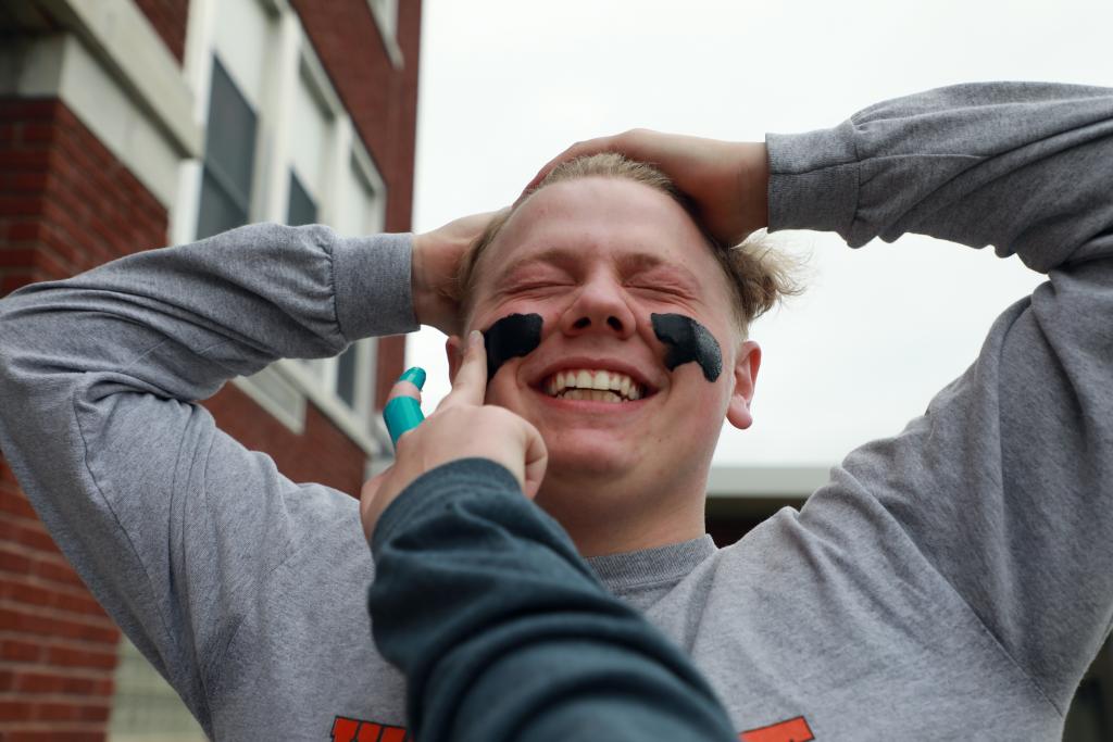 student being painted on the face