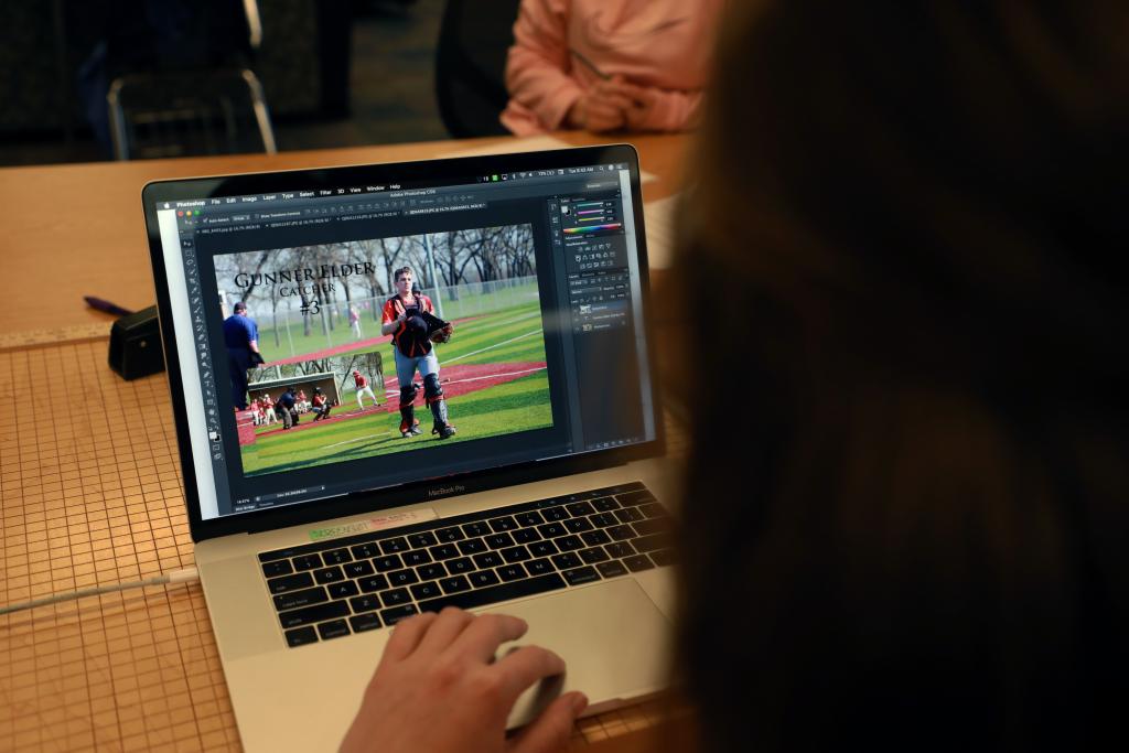 student designing on her computer