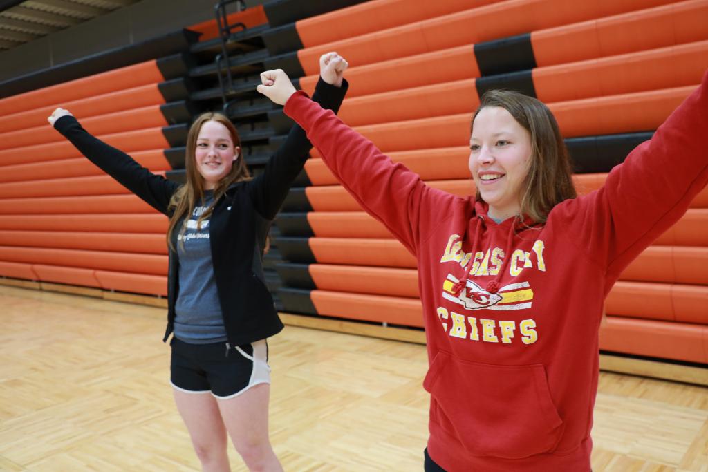 students practicing a cheer performance 