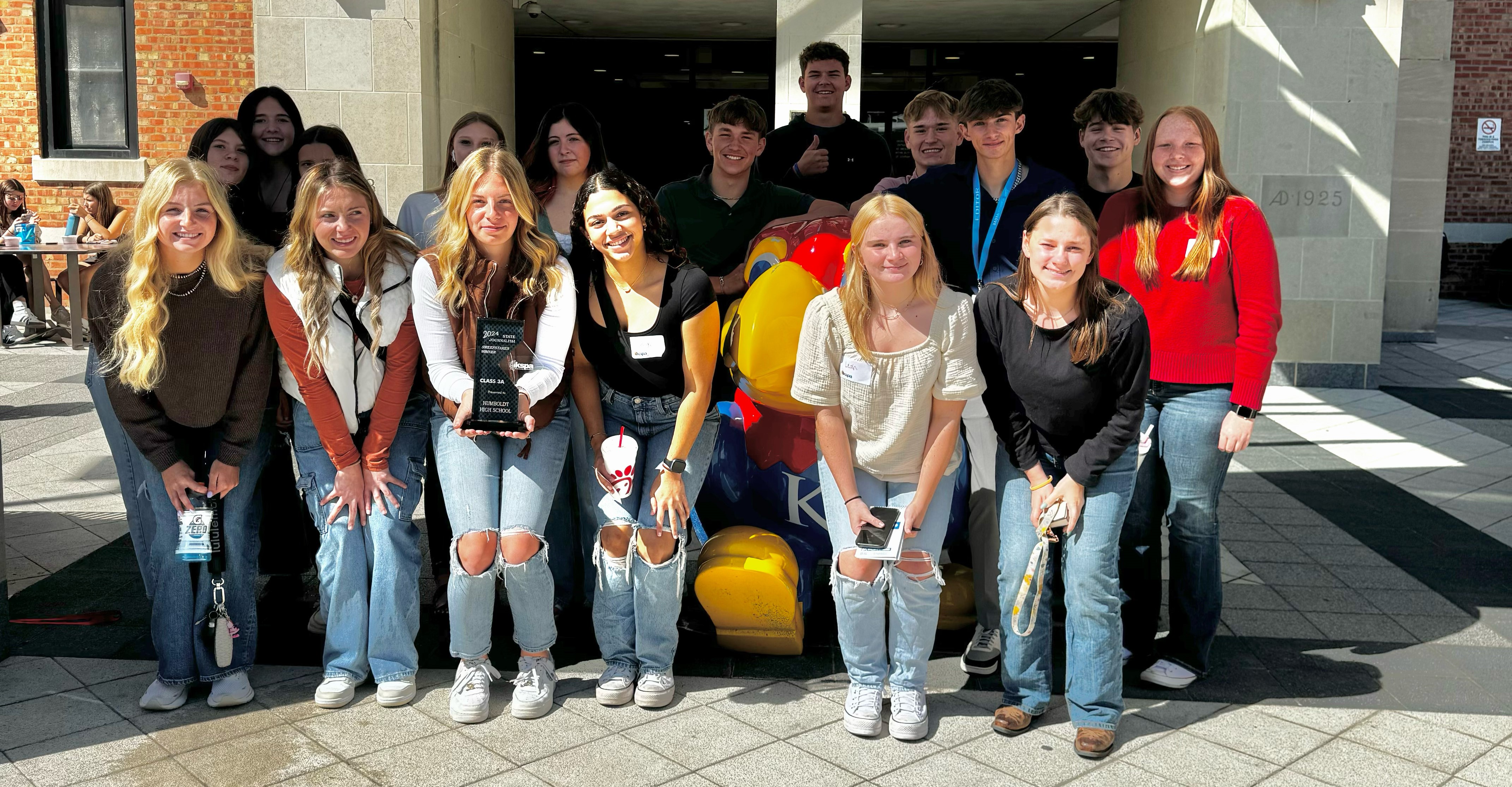 students in a group smiling for the camera