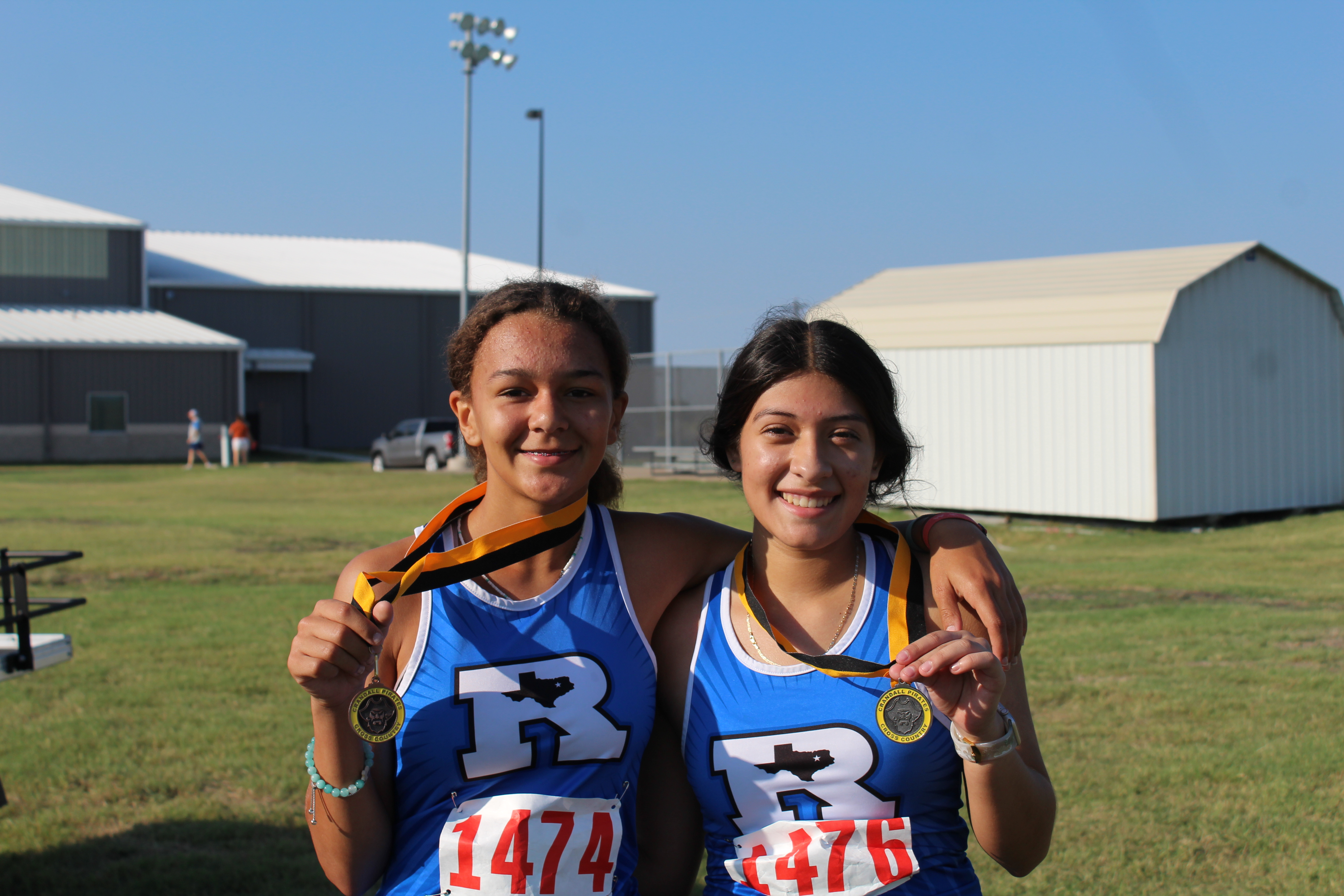Cross country girls with medals