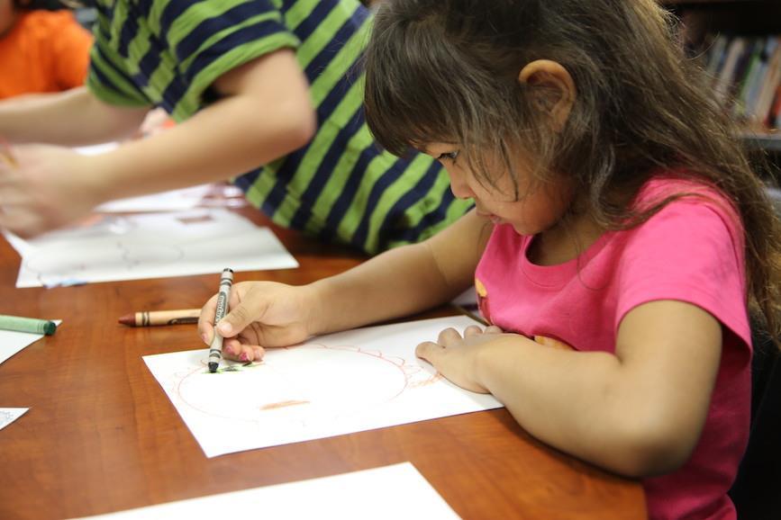 Child holding a crayon