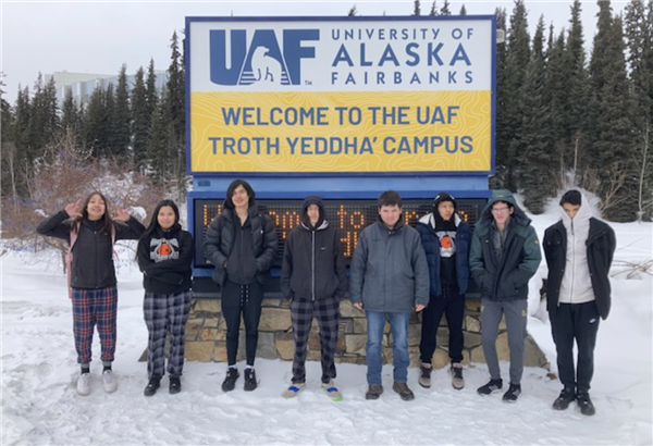 People in front of UAF Fairbanks sign