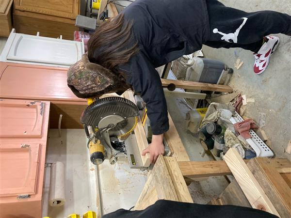 Cutting wooden planks using machinery