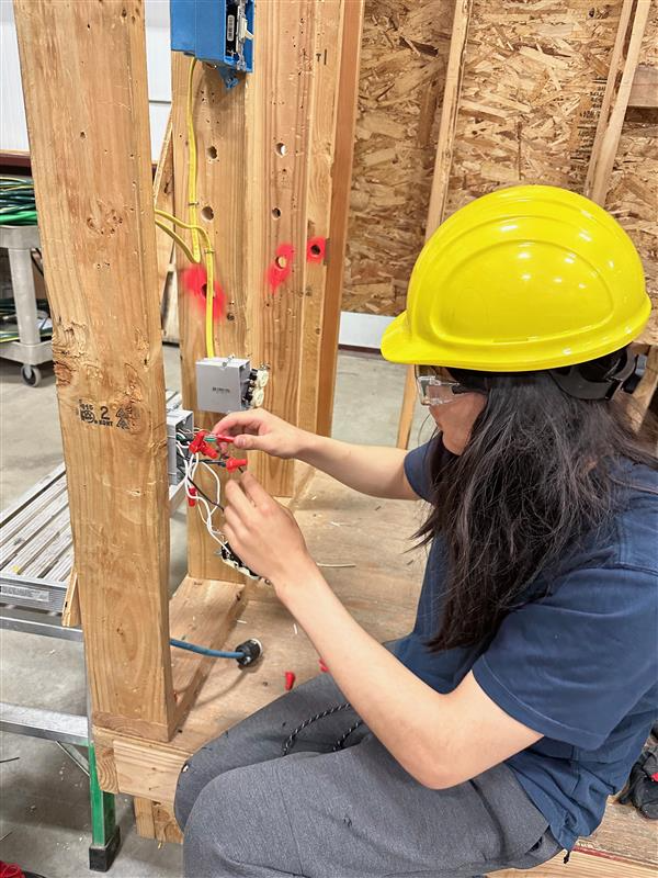 Student connecting electrical outlet 2