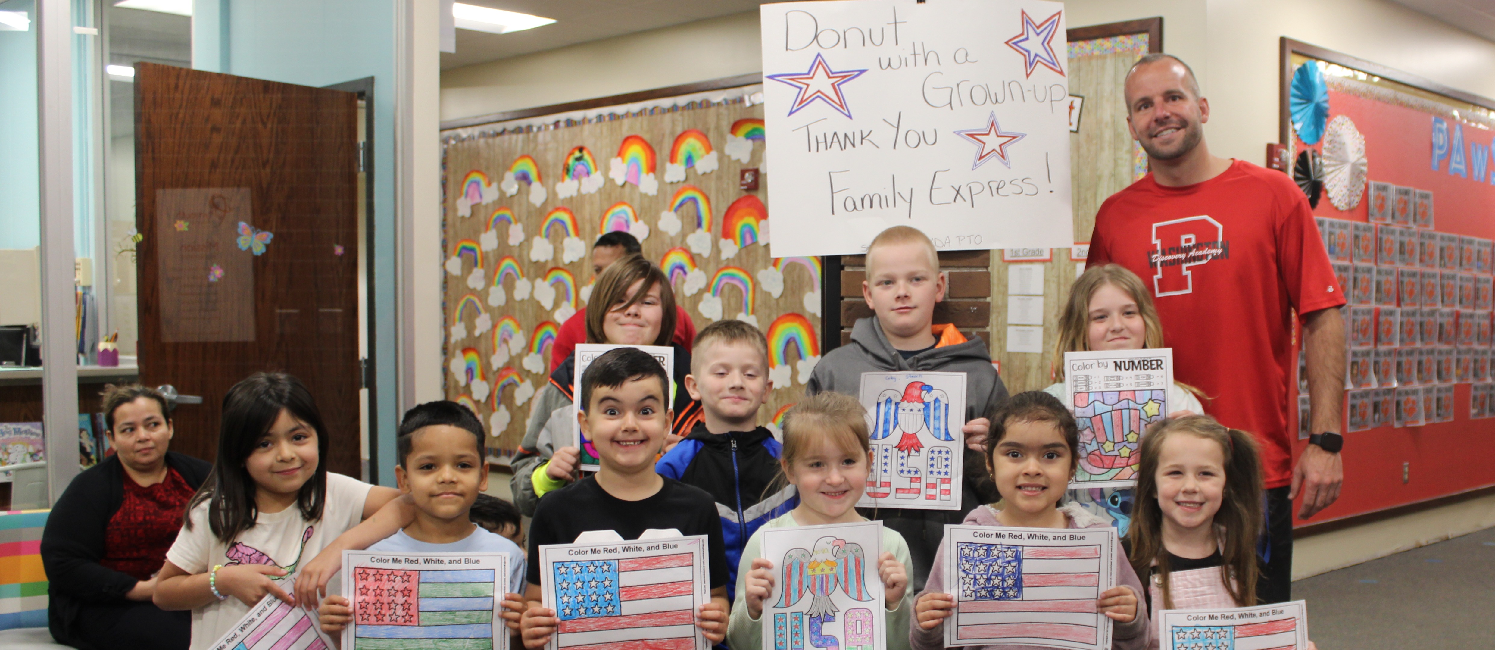 group of students in front of a thank you sign for family express