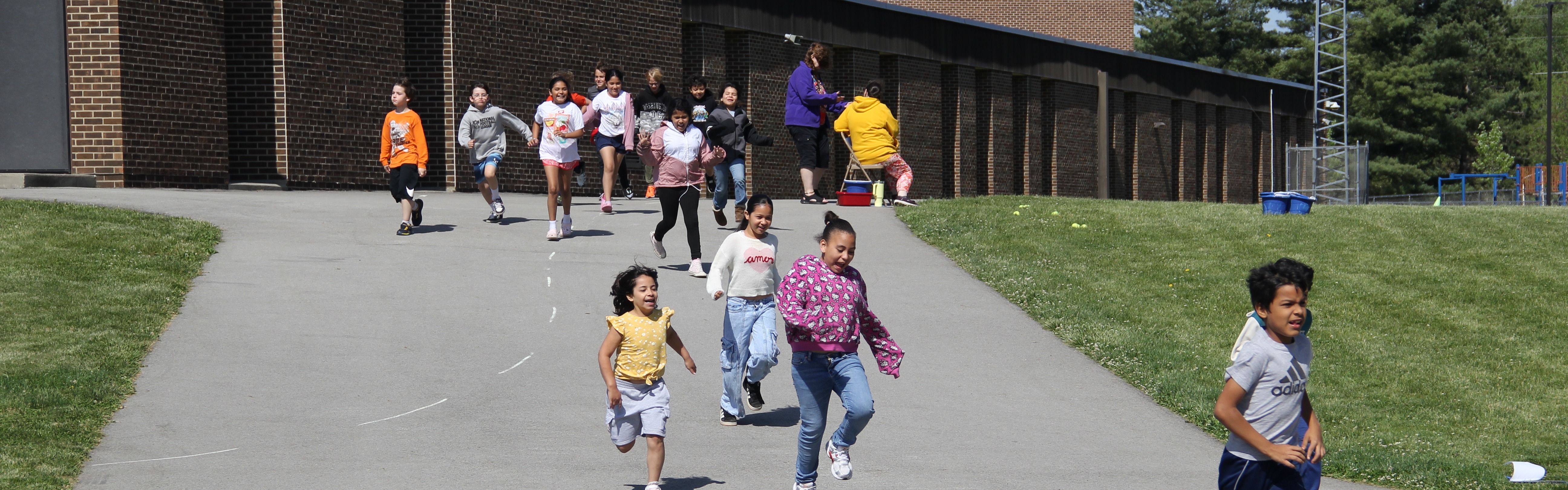 students in glowing vests