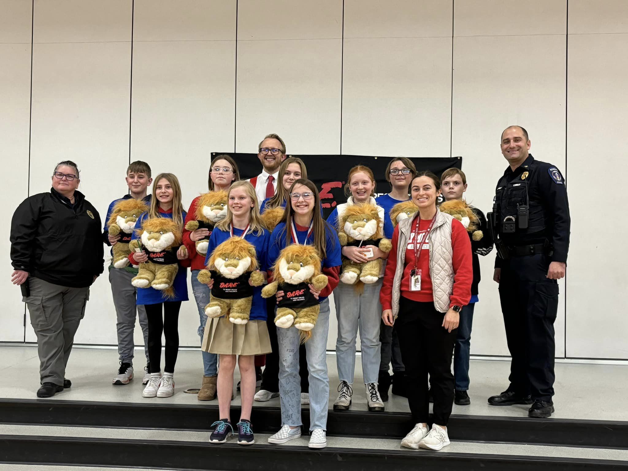 students posing at DARE graduation