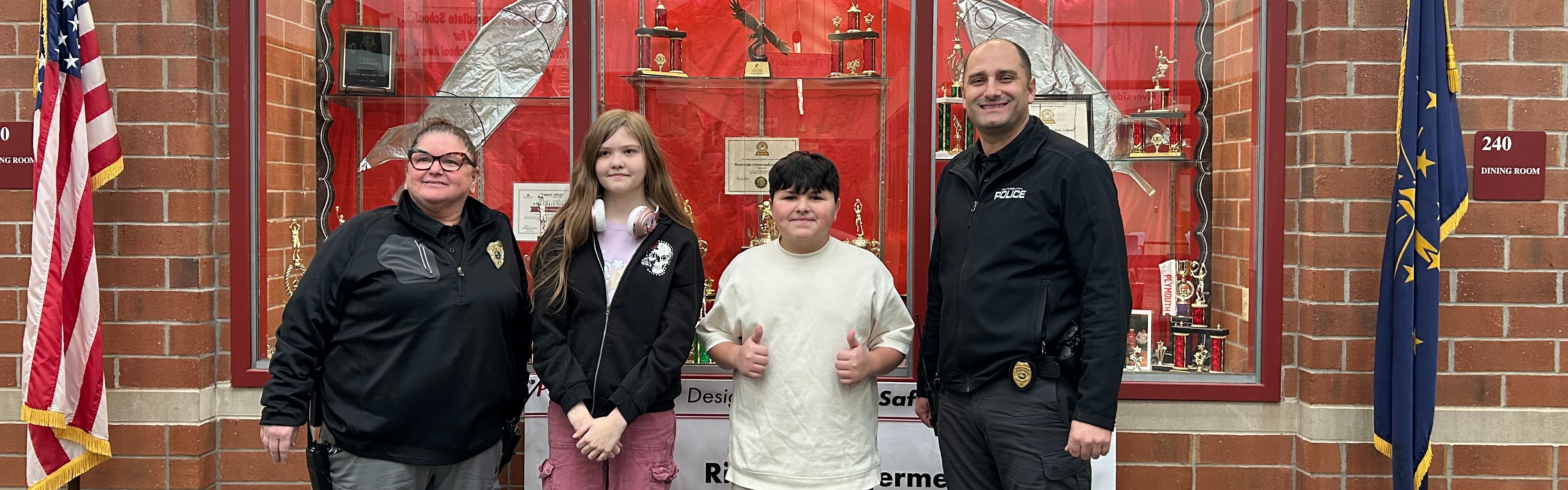 students posing at DARE graduation