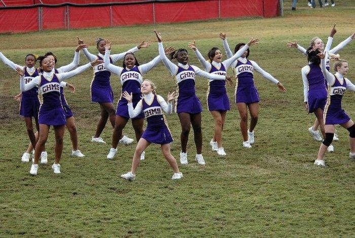 cheerleaders cheering on the football field