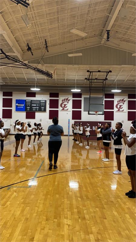 Practicing our cheers with Coach T