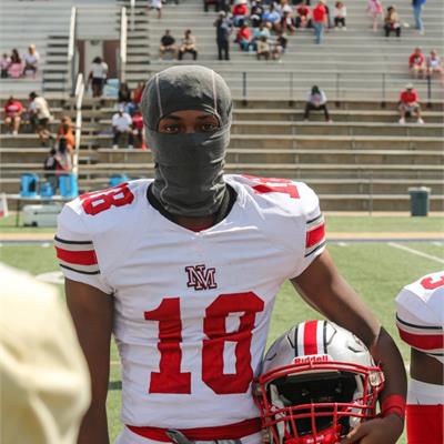 football player holding helmet