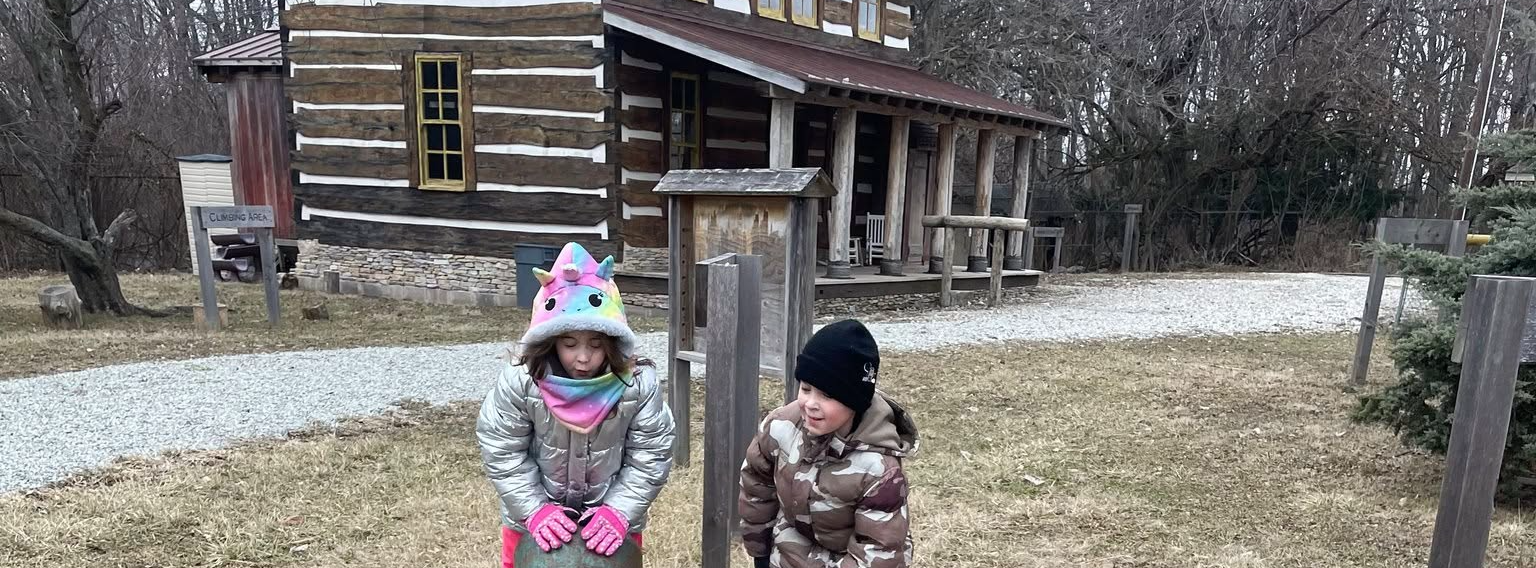 Young elementary age students exploring classroom activities