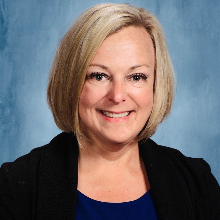 Adult female principal smiling