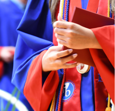 red and blue graduation gown and diploma