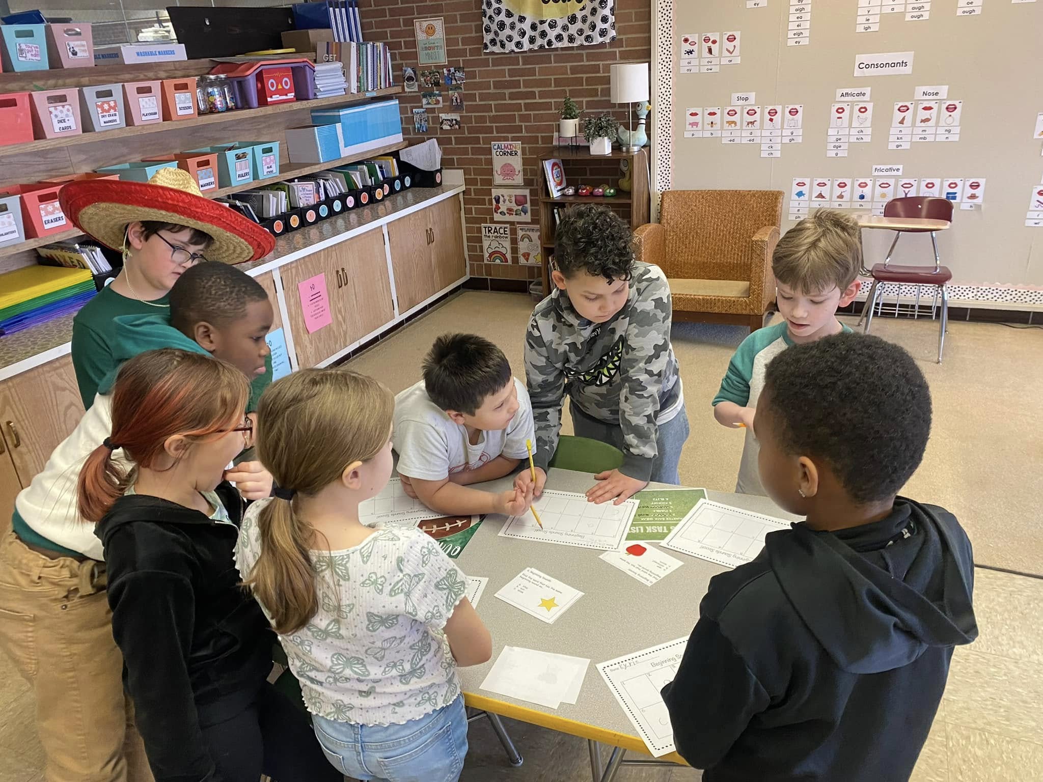 Young elementary age students exploring classroom activities