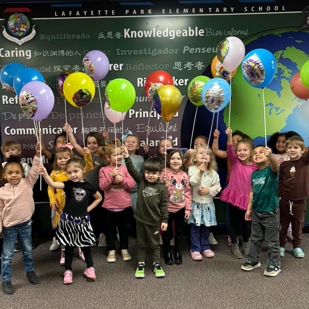 Young elementary age students exploring classroom activities
