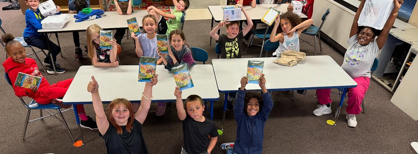 Young elementary age students exploring classroom activities
