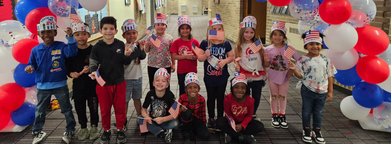 Young elementary age students exploring classroom activities