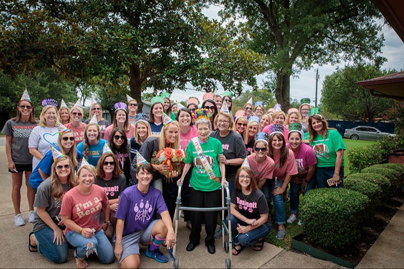 When Mrs. Bennett (center) was unable to attend her 102nd birthday celebration at school, the Bennett staff brought the celebration to her doorstep.