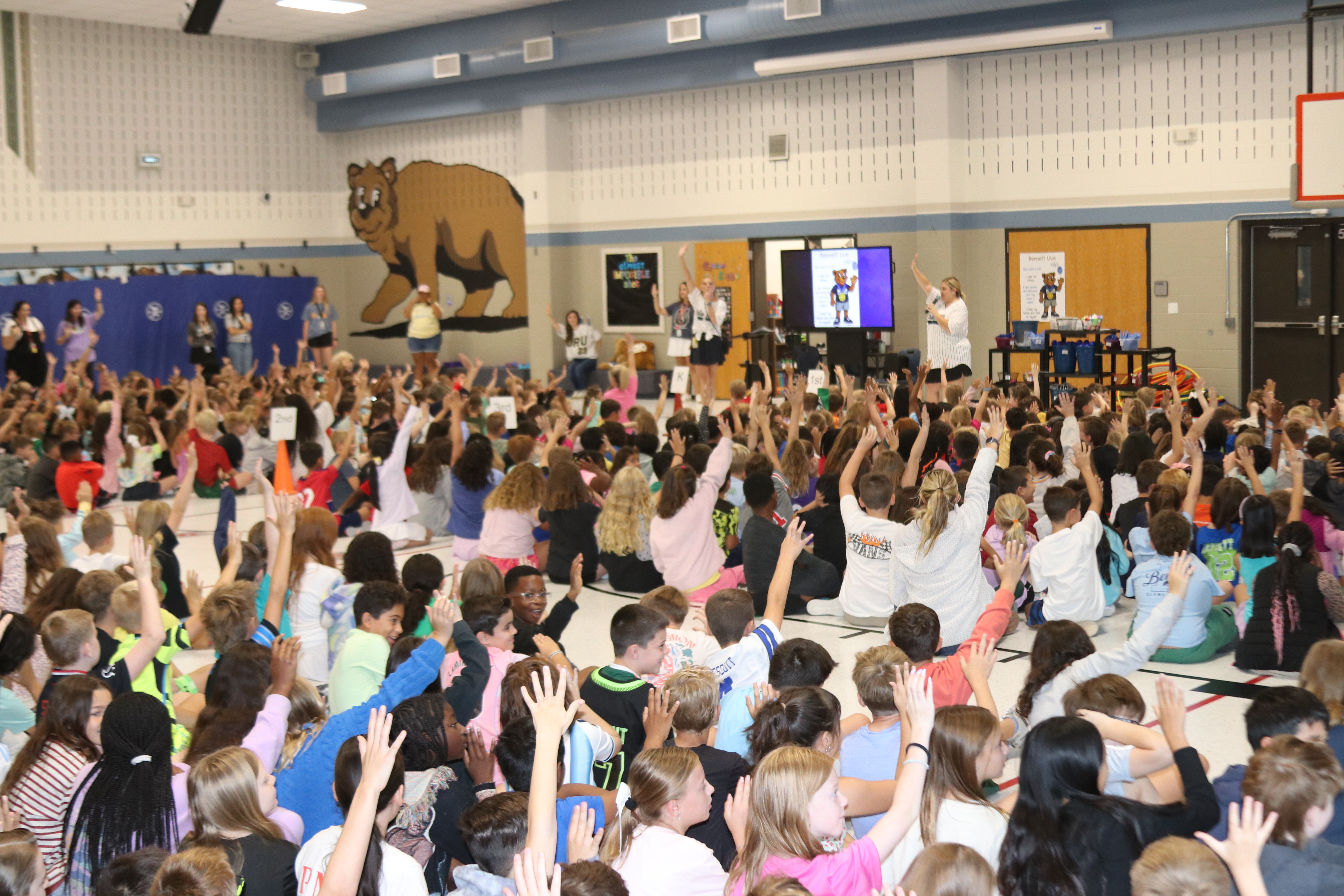 Students giving five at first assembly