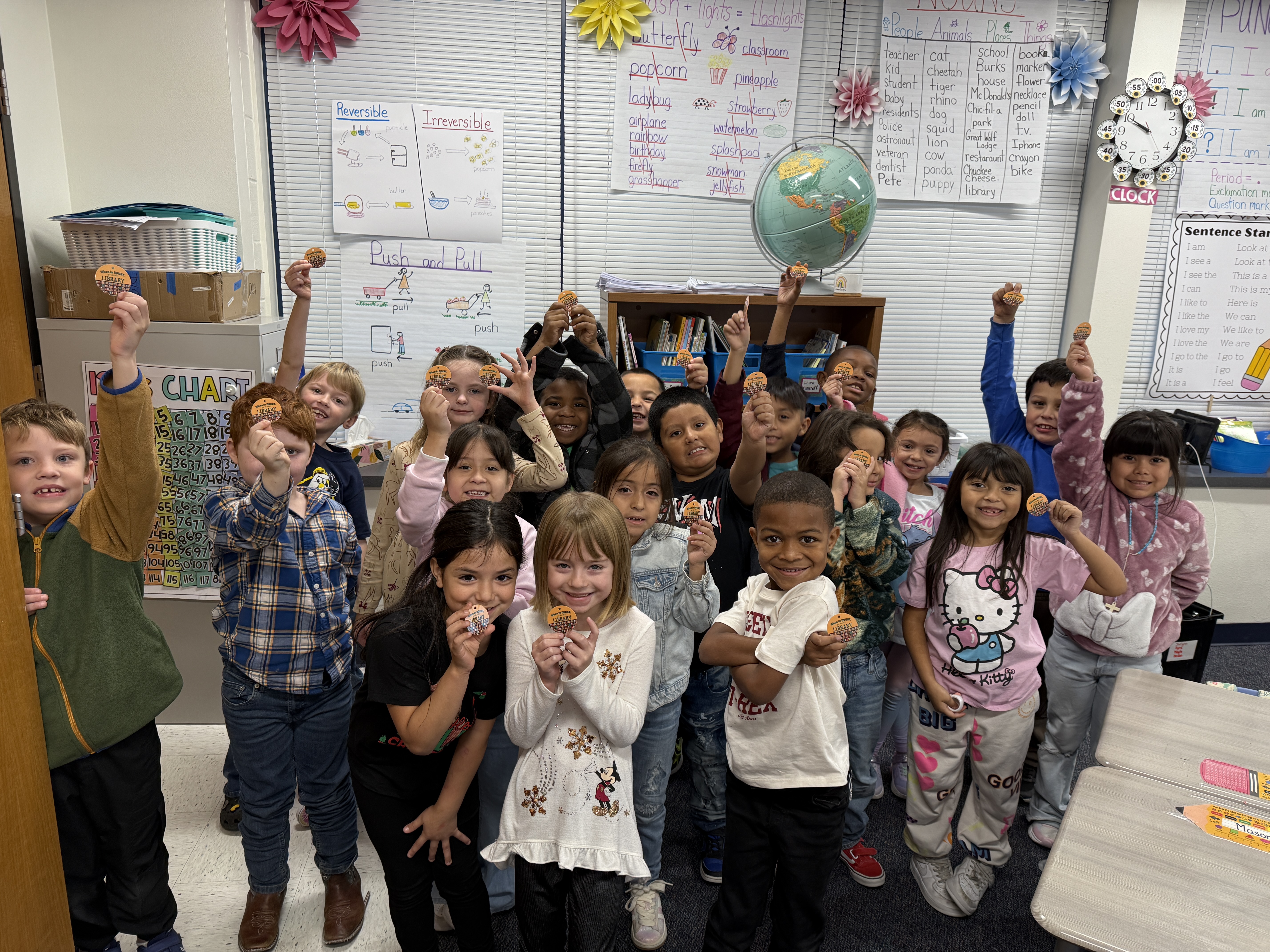 1st grade class all holding their Autumn Challenge BEAR tags.
