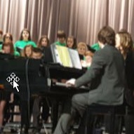 students and teacher practicing the choir
