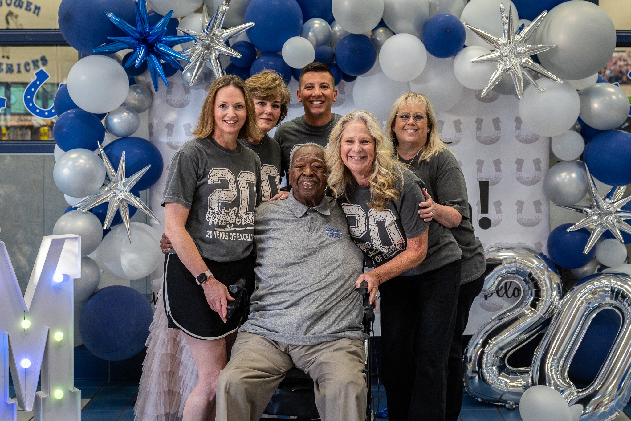 Mr. McGowen and administrators celebrate Jesse McGowen Elementary School turning 20 years old.