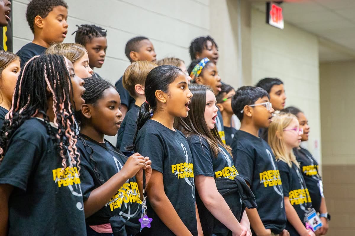 Press Pride Performers performing for School Board members as the visited 