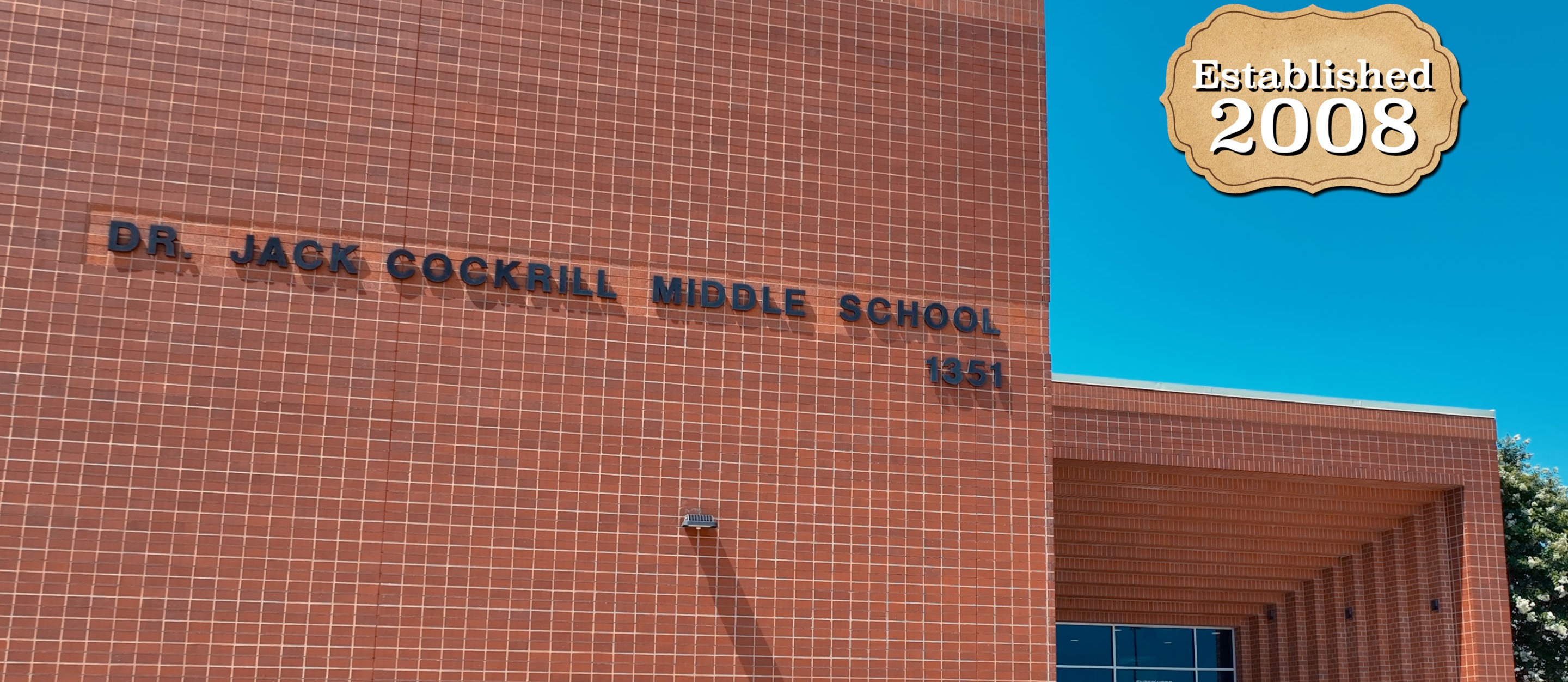 View of Cockrill Middle School from the front parking lot with "Established in 2008" text.