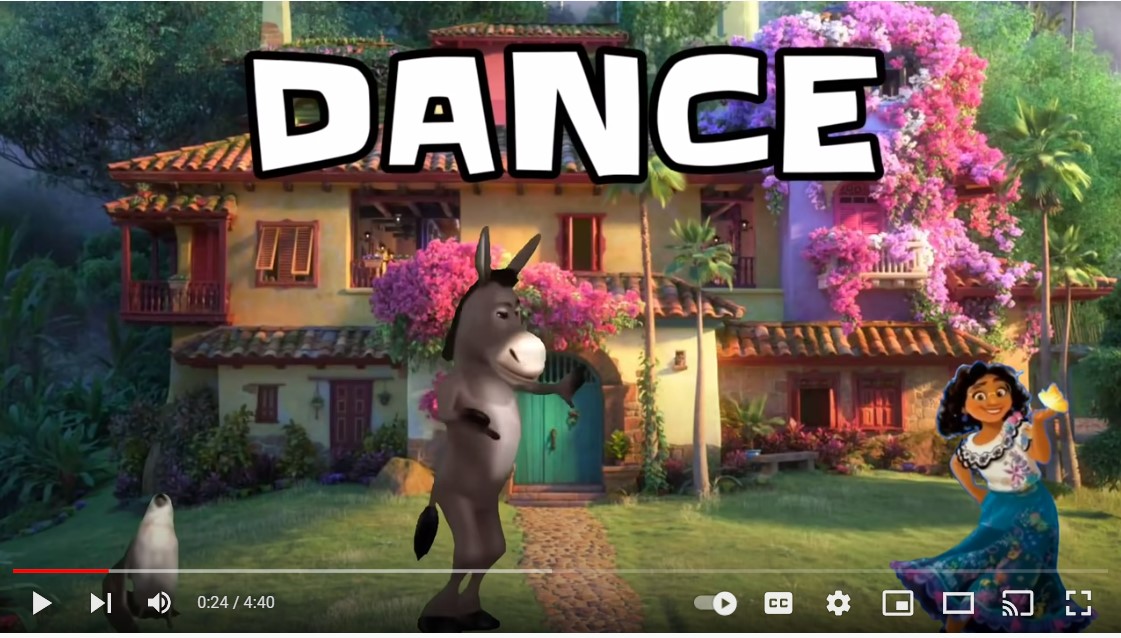 monkey dancing in front of a house