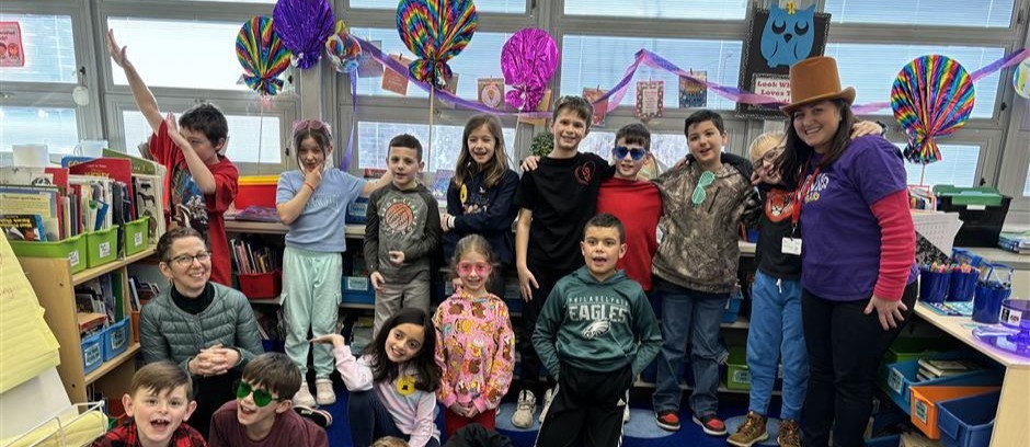 Students and teachers dress up and take a group photo for Wonka day