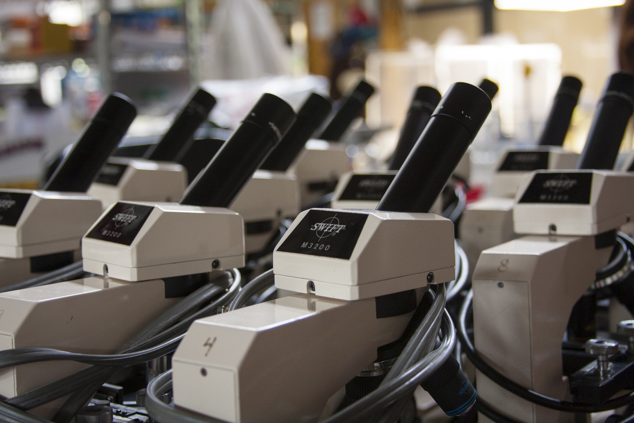 A row of machines lined up in a factory, ready for operation.