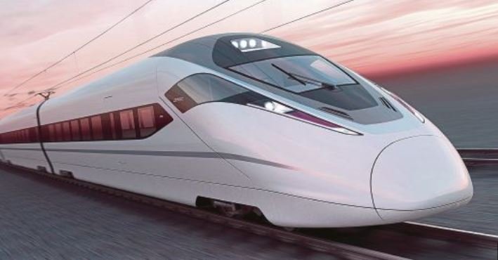 A high-speed train zooms along the tracks, showcasing its swift and efficient mode of transportation.