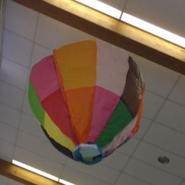 A colorful hot air balloon being launched into the sky for a thrilling adventure.