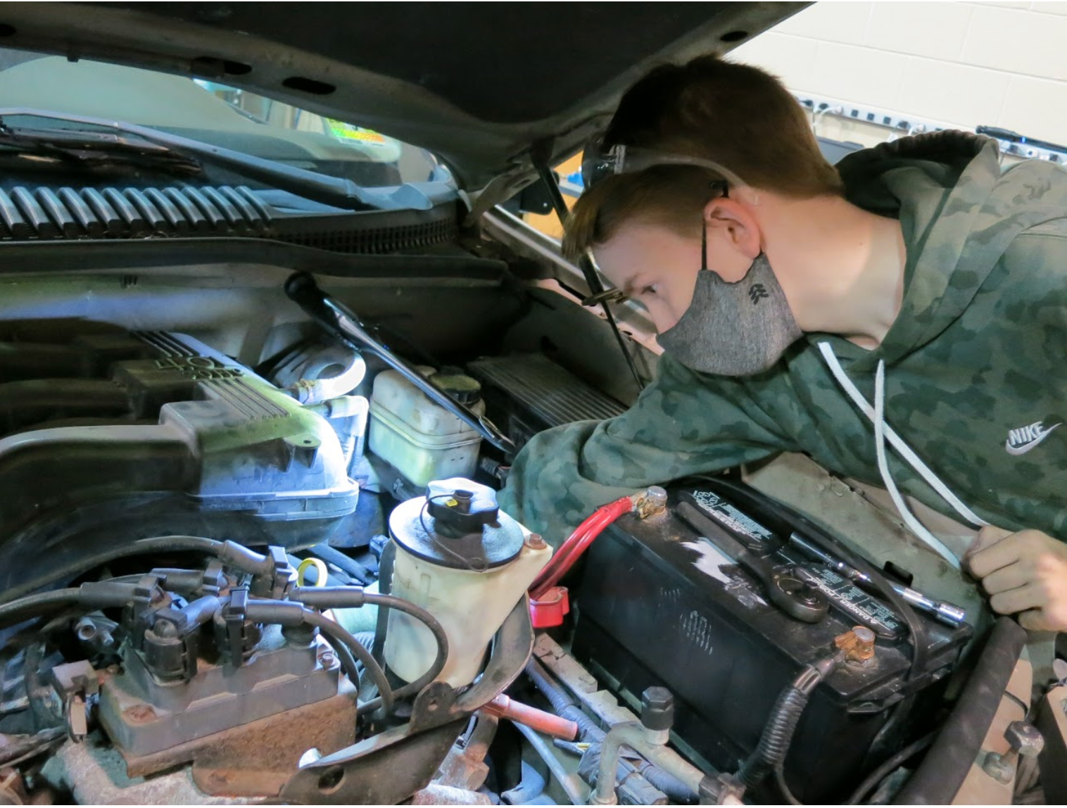 Automotive Student working on an engine