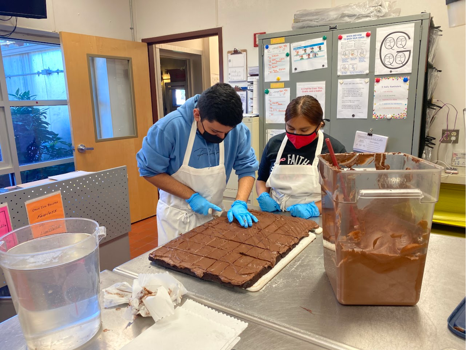 Students cutting cake