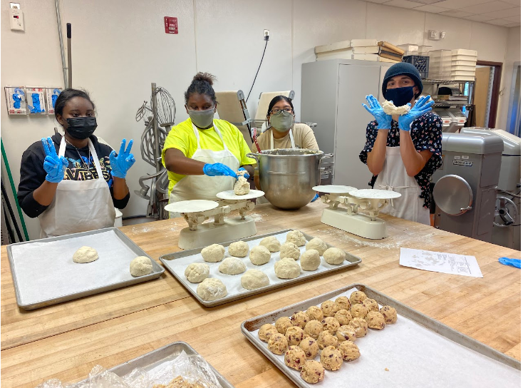 Students prepping food to bake