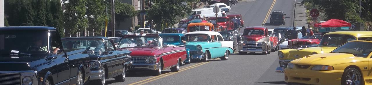 A picture of classic cars on the roads.
