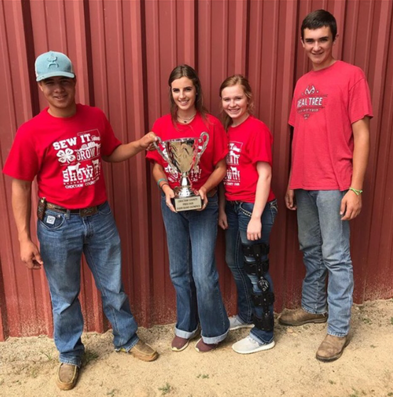 Competitors winning the trophy 