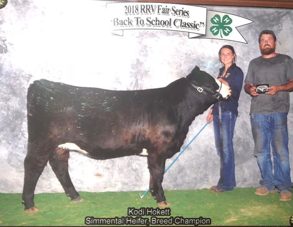 Kodi Hokett and companion with a cow winning the competition 