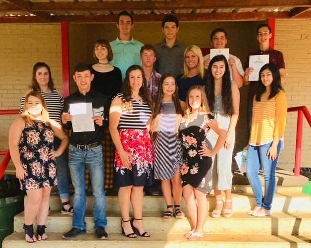students posing for a picture in the national honor society