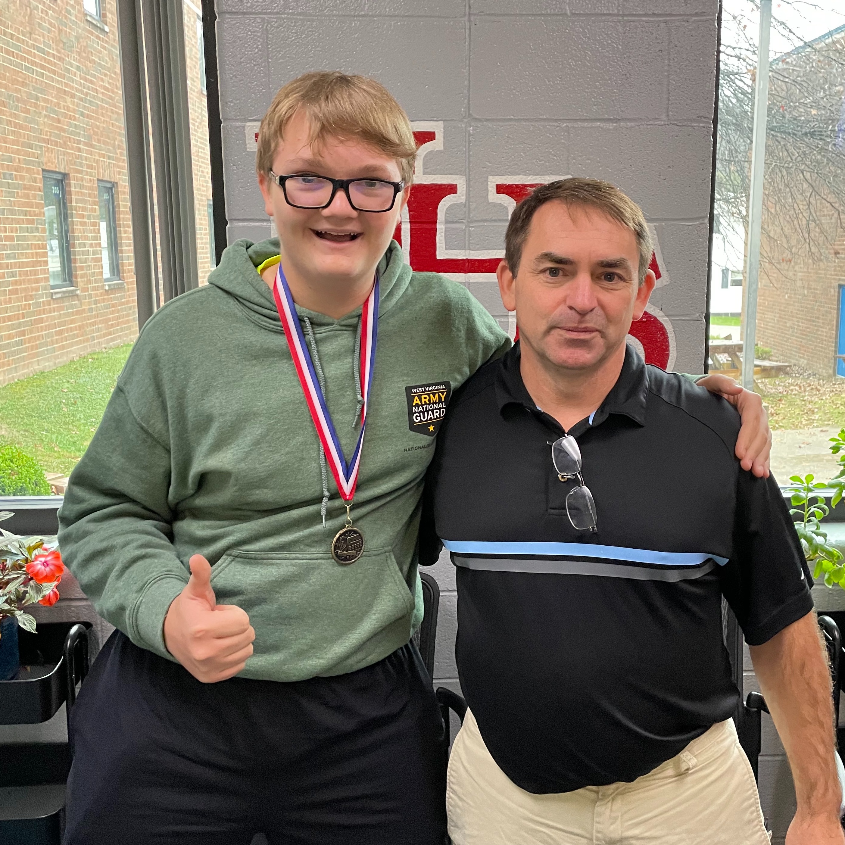 Math Day Champion and his coach